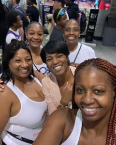 A group of women smiling at the camera